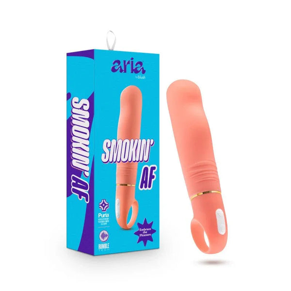 Aria Smokin' AF vibrator in coral with ribbed shaft and gold band, beside its box