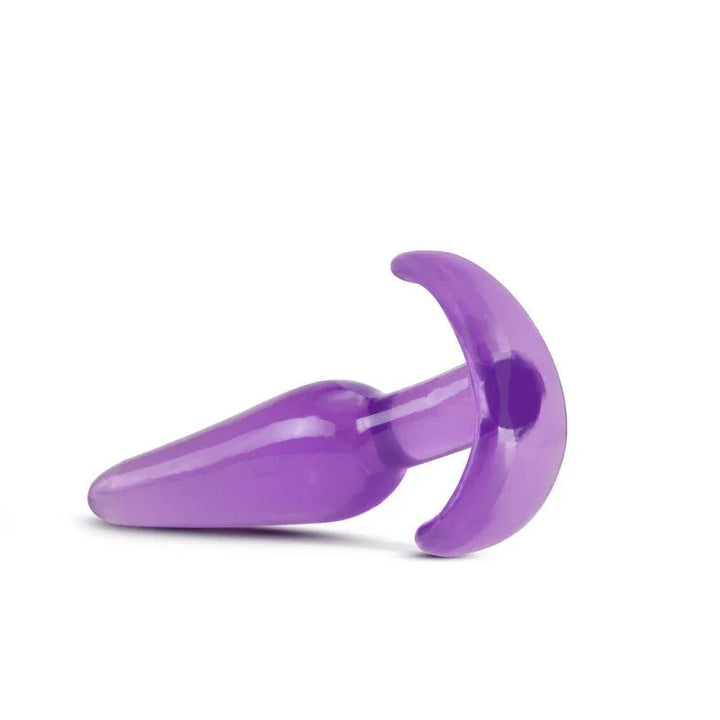 Purple B Yours slim plug lying down with the curved base toward the camera