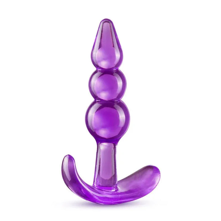 Purple triple bead anal plug upright, three graduated beads above a curved base
