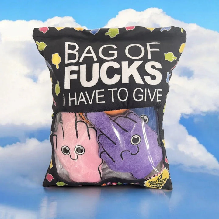 Bag Of Fucks plush pillow pack pictured against a blue sky with clouds