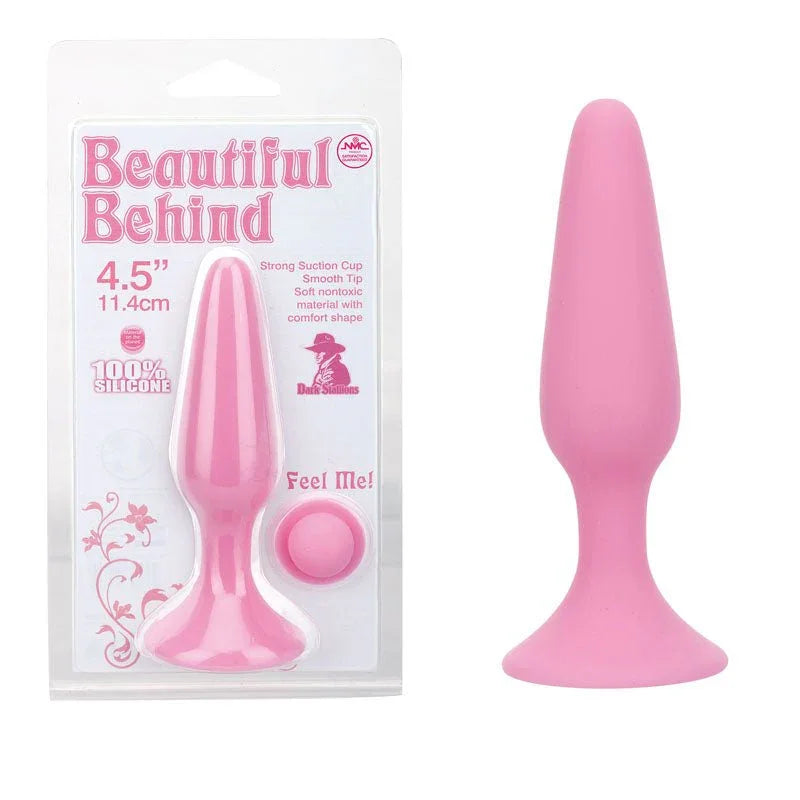Beautiful Behind 11.5 cm butt plug in Pink, tapered plug beside its blister card