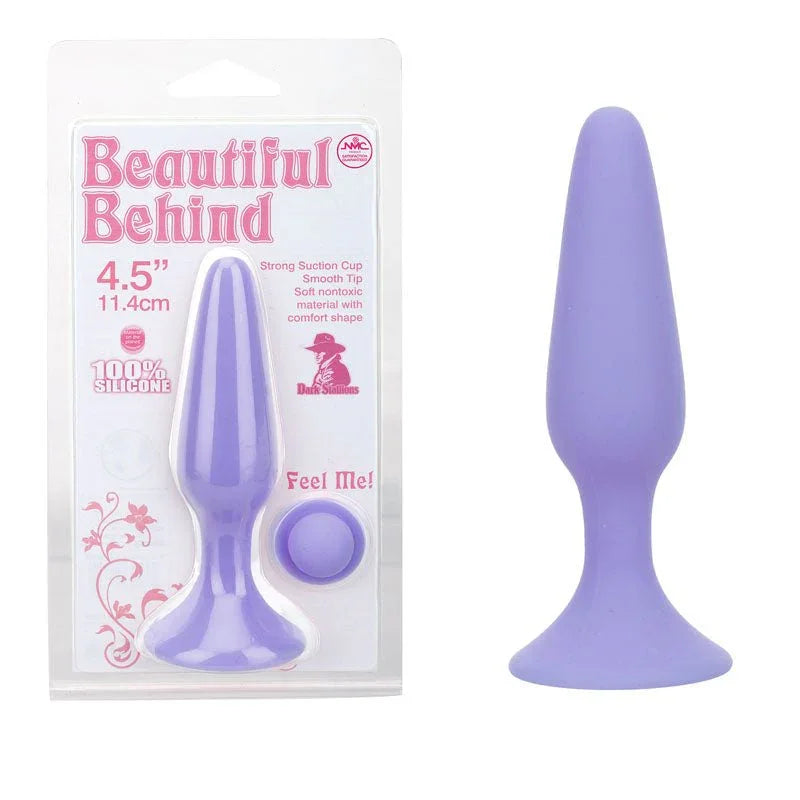 Beautiful Behind 11.5 cm butt plug in Purple, showing the suction base, beside its blister card