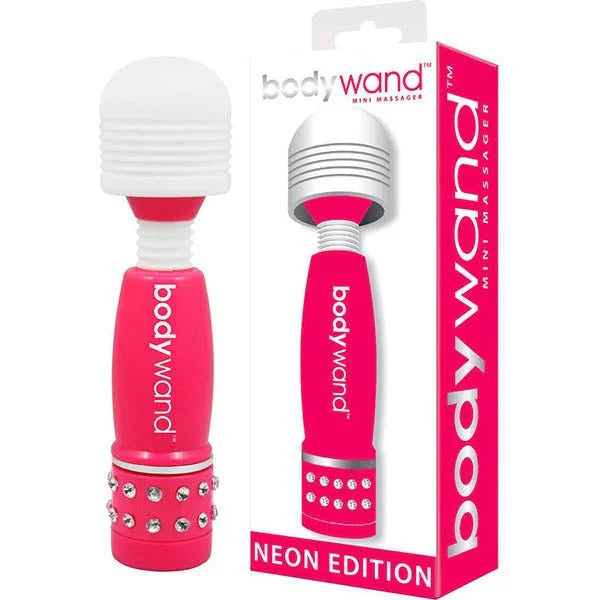 Bodywand Mini Massager in neon pink, silicone, with rhinestone base and ribbed head.