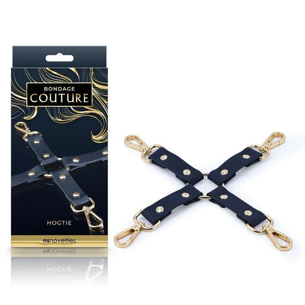 Bondage Couture hog tie in Blue, navy straps in a cross with gold clips, beside its box