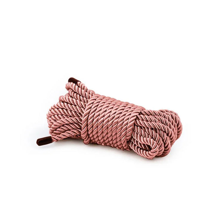 Bondage Couture rope in Rose Gold, coiled hank on white showing the twisted satin strands