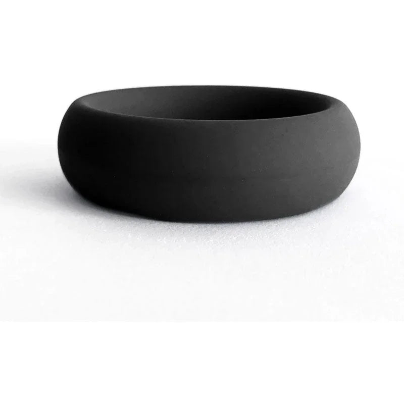 Black silicone cock ring, smooth matte finish, stretchable band for enhanced sensation.