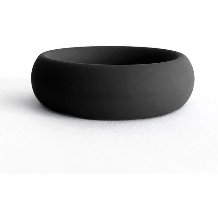 Black silicone cock ring, smooth matte finish, stretchable band for enhanced sensation.