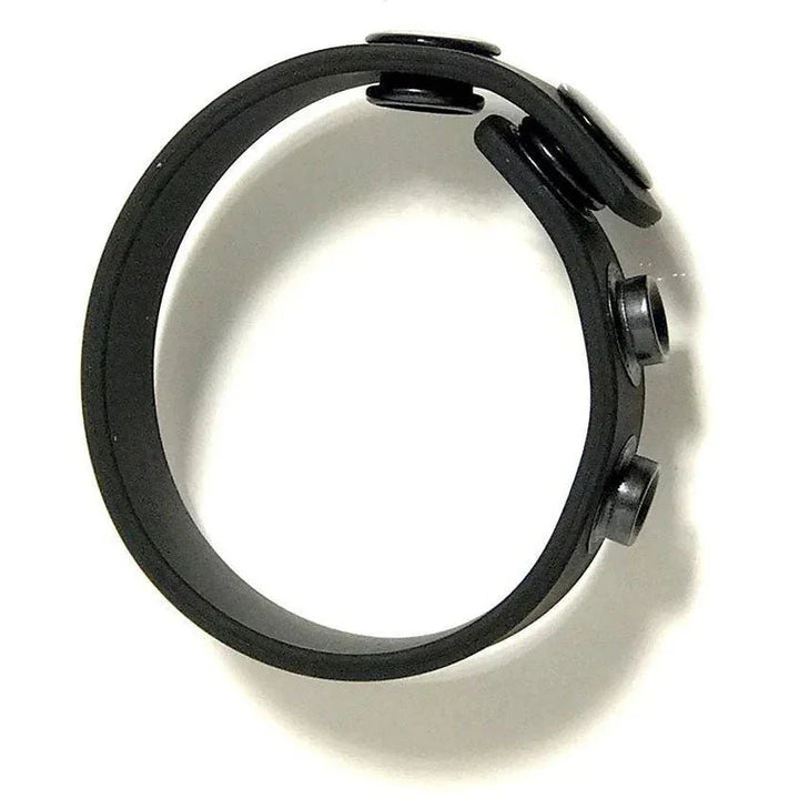 Boneyard Cock Strap snapped into a ring, showing the three snap studs