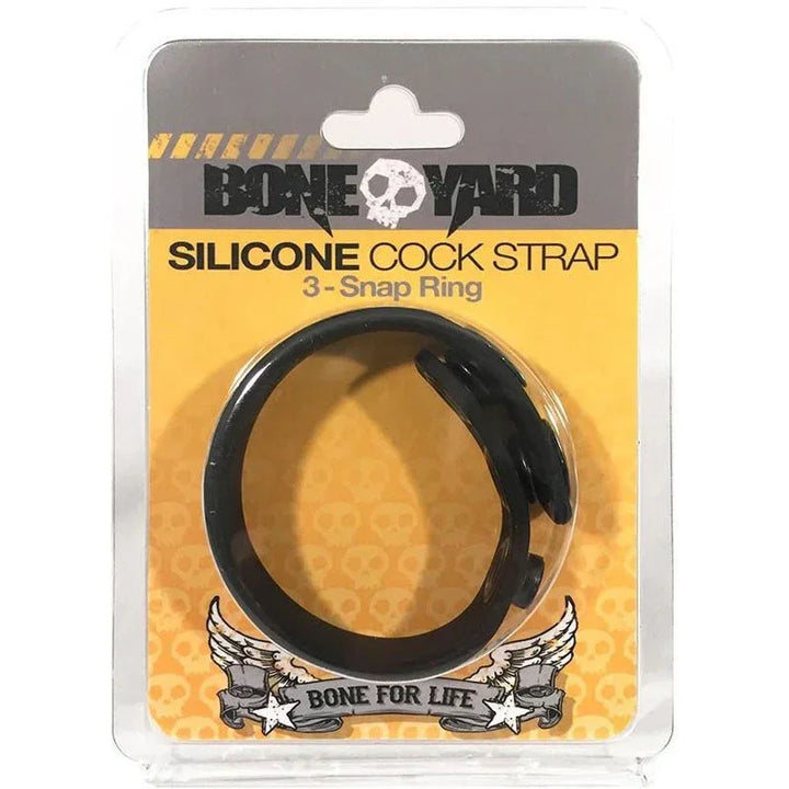 Boneyard Cock Strap 3-snap ring in Black, sealed in its yellow blister card