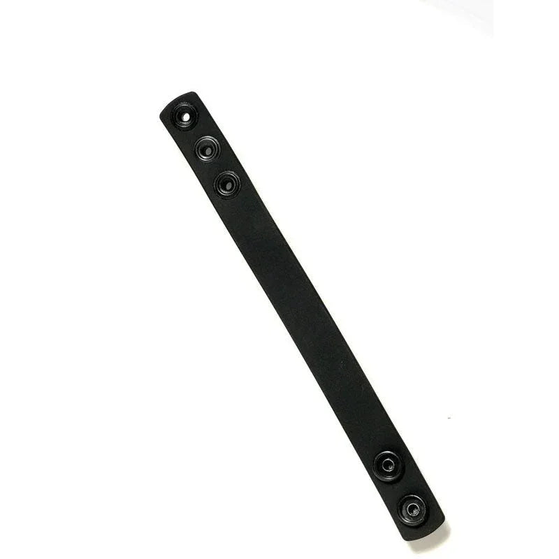 Boneyard Cock Strap unsnapped strap laid diagonally on white