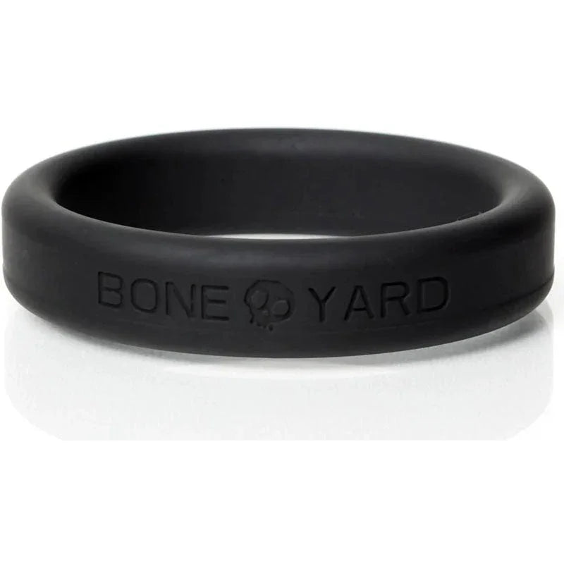 Bone Yard cock ring in black, silicone, with embossed branding.