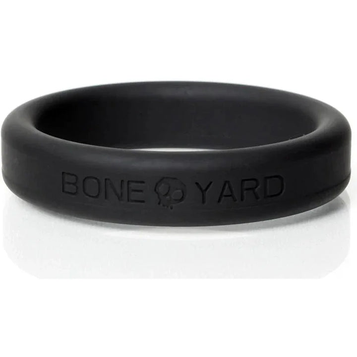 Bone Yard cock ring in black, silicone, with embossed branding.