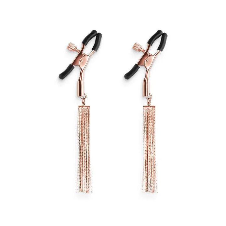 Bound nipple clamps in Rose Gold, pair on white showing the black silicone tips
