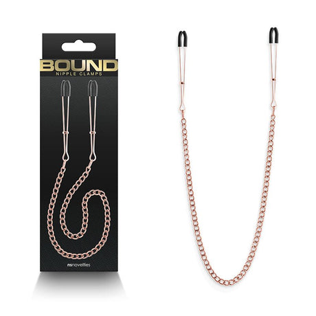 Buy Bound Nipple Clamps - DC3 - Rose Gold - Rose Gold Nipple Clamps with Chain – Naughtyhut NZ sex toys online. Discreet delivery & top brands.