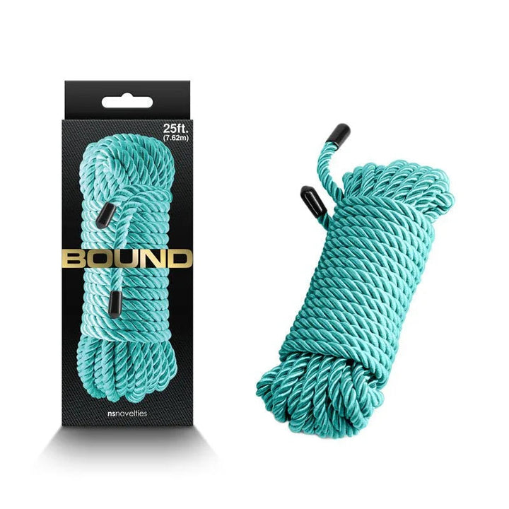 Bound bondage rope in Green, 7.6 m coiled with capped ends, beside its Bound box