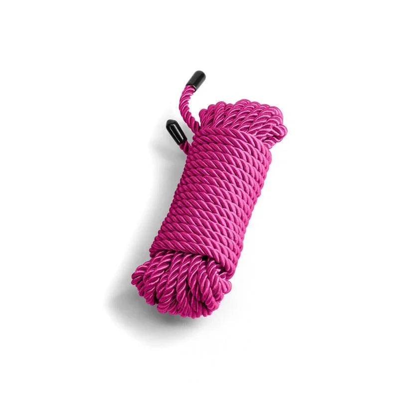 Bound bondage rope in Pink, coiled hank on white showing the twisted strands