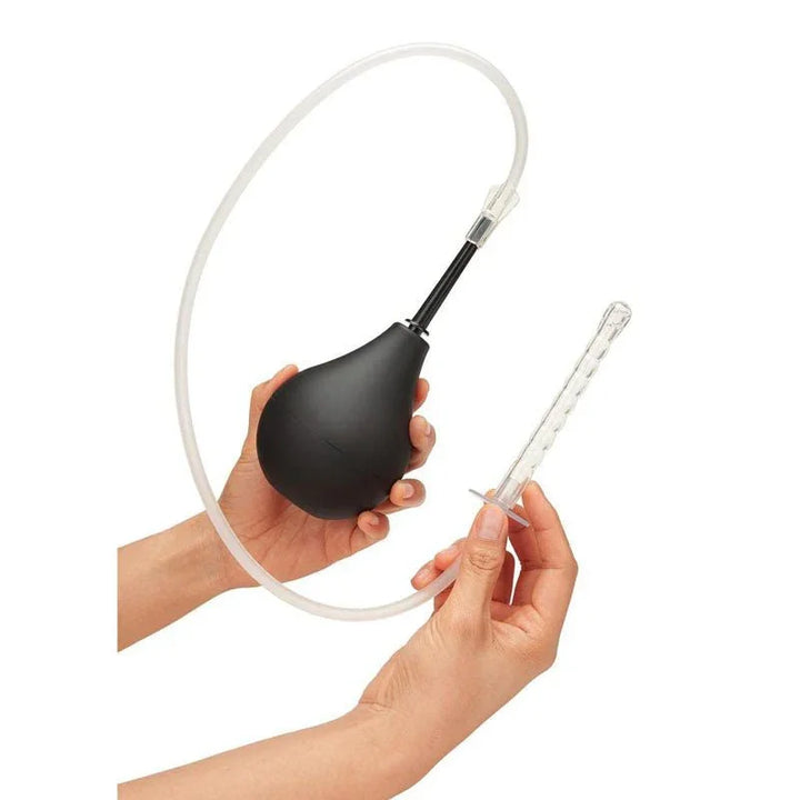Hands holding the CleanScene black bulb with the long flexible hose and tip attached