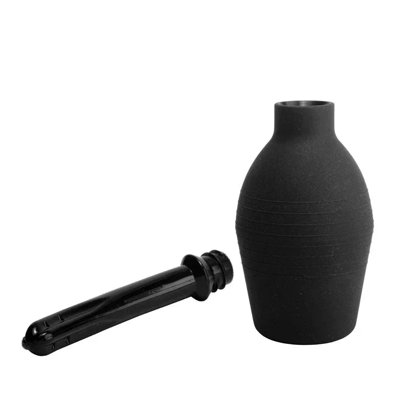 Black silicone anal plug with ribbed texture and tapered design, body-safe material.