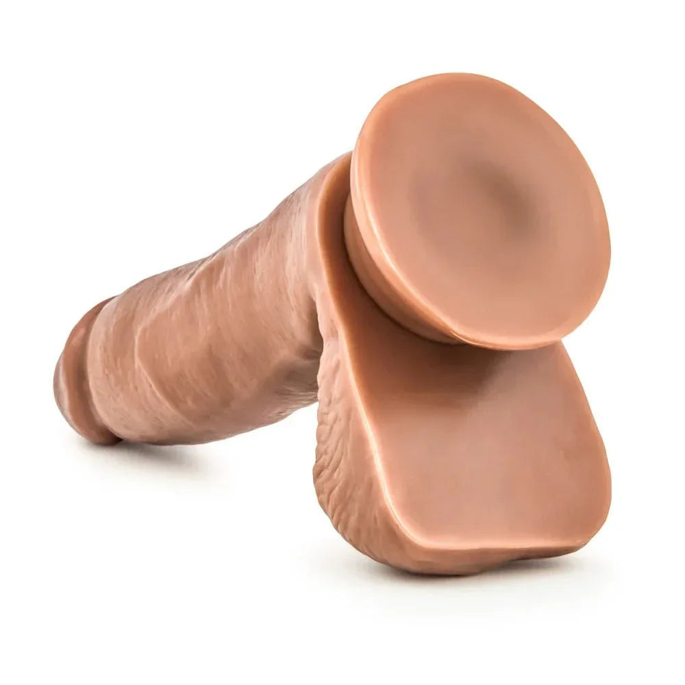 Coverboy Manny The Fireman in tan lying on its side, suction cup toward camera