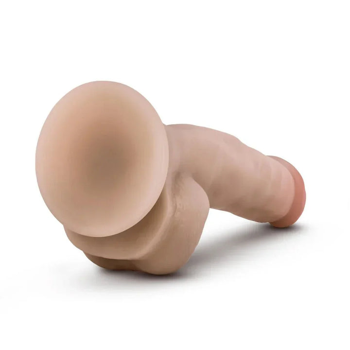 Coverboy Mr. Jackhammer lying on its side, suction cup toward the camera