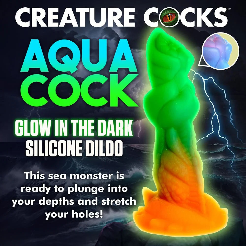 Aqua-Cock title panel showing the dildo glowing bright green in the dark