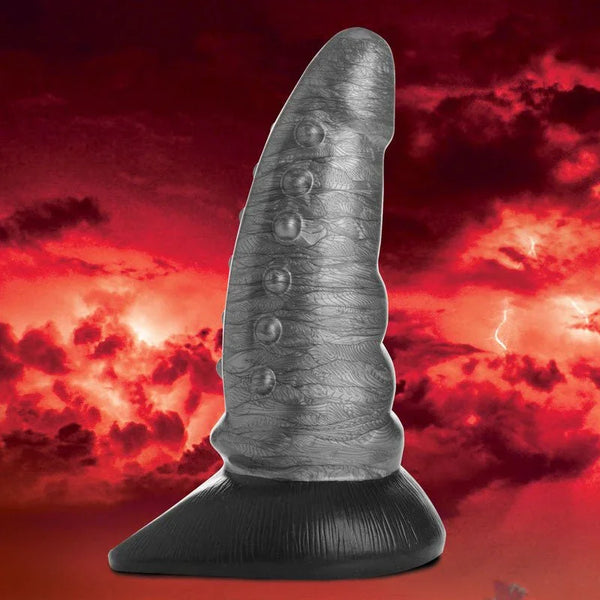 Creature Cocks Beastly dildo in Silver, bumpy grey sculpt on a black base against a red sky