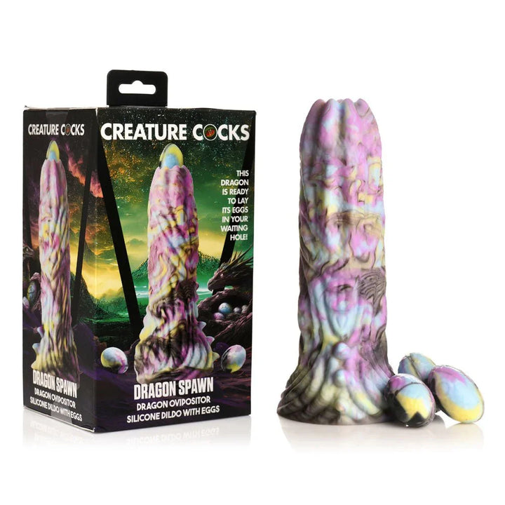 Creature Cocks Dragon Spawn ovipositor dildo and its three eggs beside the retail box