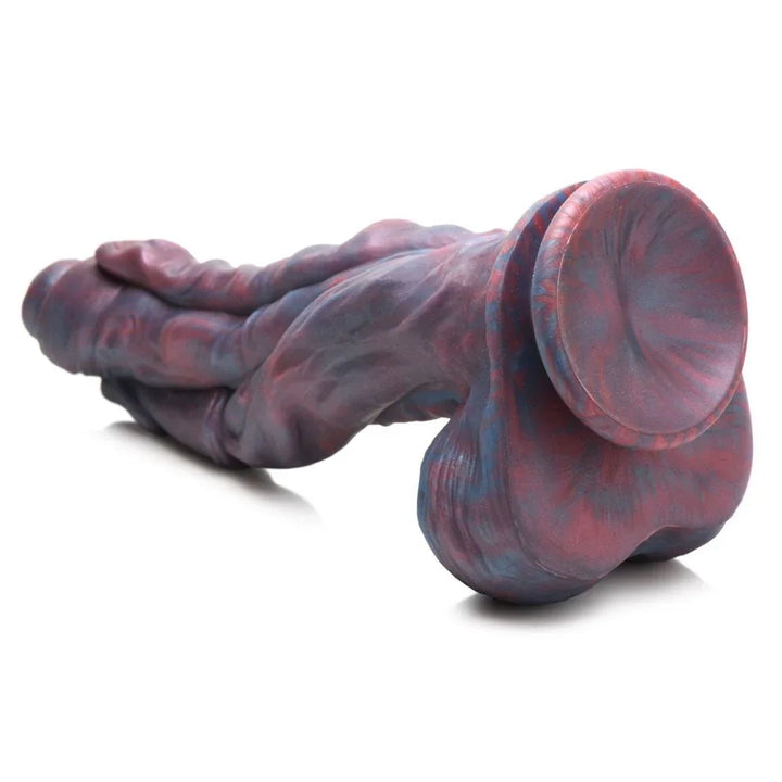 Hydra dildo lying with the suction cup face-on, showing the flat mounting disc