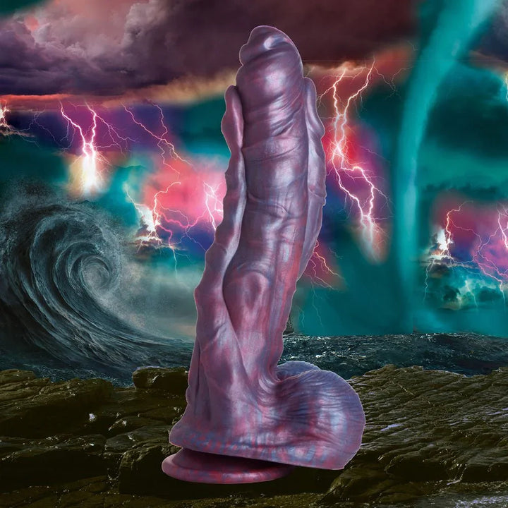 Hydra dildo upright on a stormy ocean backdrop, purple and red marbled silicone