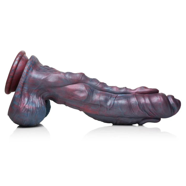 Hydra dildo lying flat on white, side profile with the suction cup at left