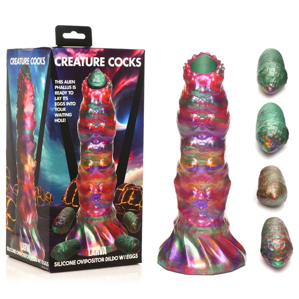 Creature Cocks Larva ovipositor dildo with its four silicone eggs, beside the retail box