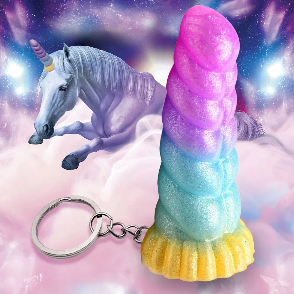 Mystique unicorn keychain standing upright on cloud artwork, rainbow glitter silicone