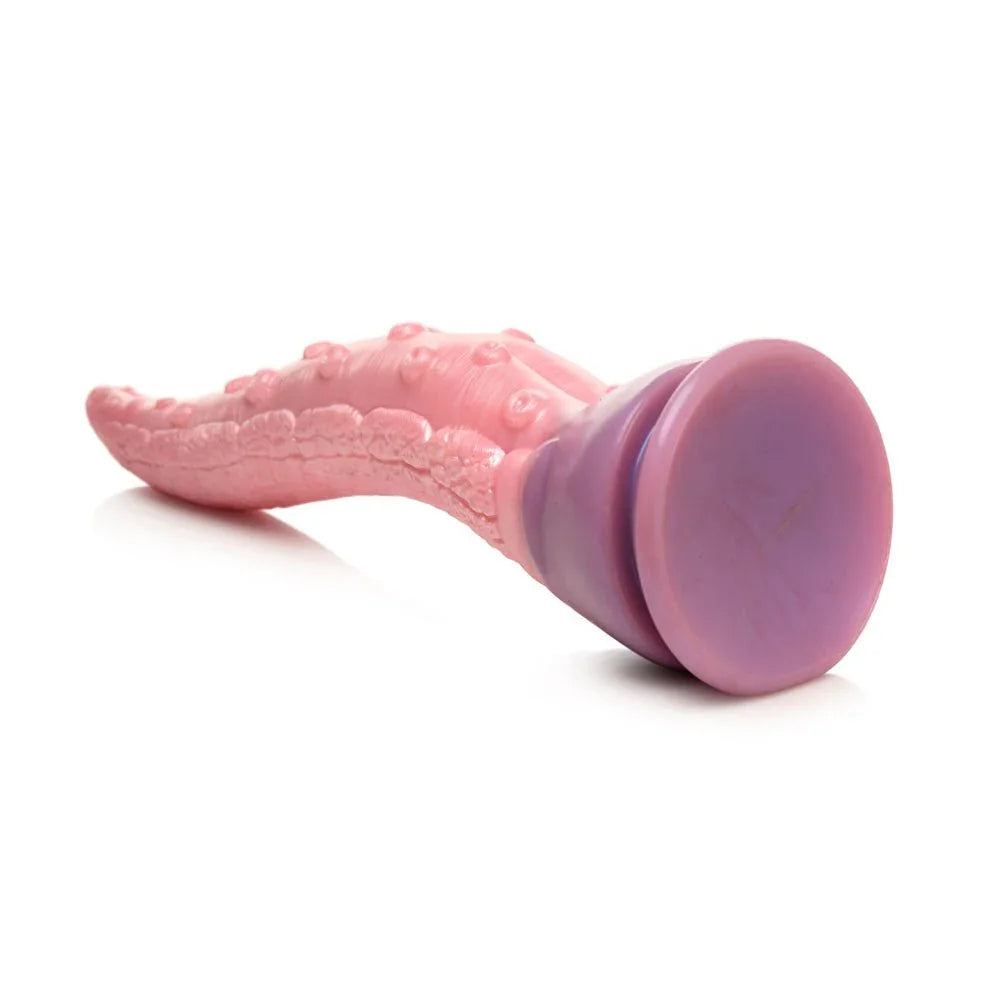 Octoprobe dildo lying with its purple suction base facing the camera