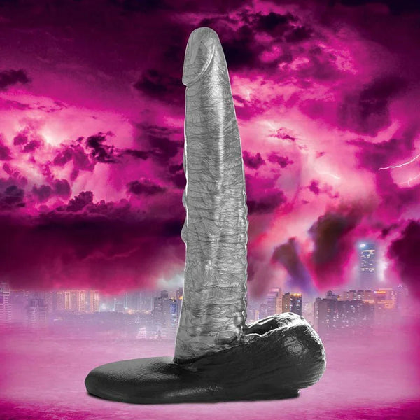 Creature Cocks The Gargoyle dildo in Silver, grey veined sculpt on a black base against a pink sky
