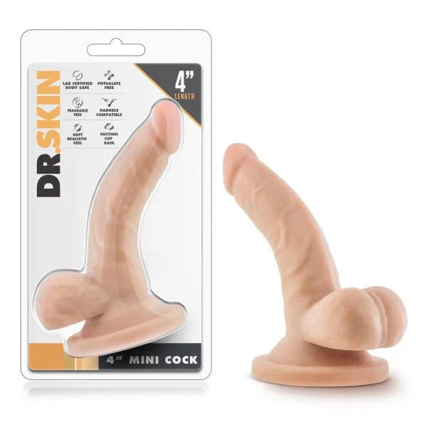 Dr. Skin 4 inch Mini Cock in flesh tone with balls and suction base, beside its blister pack