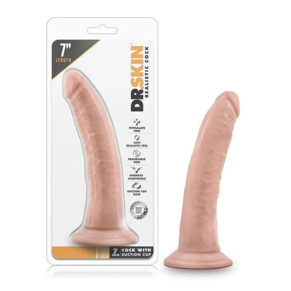 Dr. Skin 7 inch cock with suction cup in flesh tone, beside its blister pack