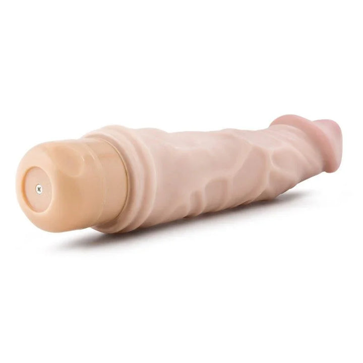 Dr. Skin Cock Vibe 6 lying down with the twist-dial battery cap toward the camera