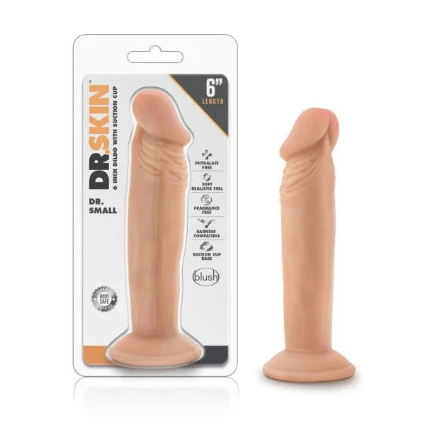 Dr. Skin Dr. Small 6 inch dong in flesh tone with suction base, beside its blister pack
