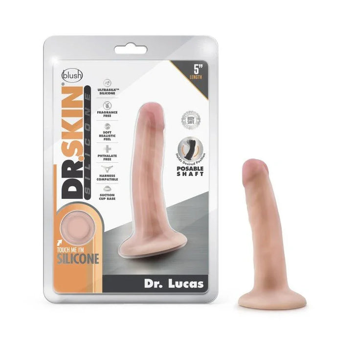 Dr. Skin Silicone Dr. Lucas dong in flesh tone beside its 5 inch blister pack