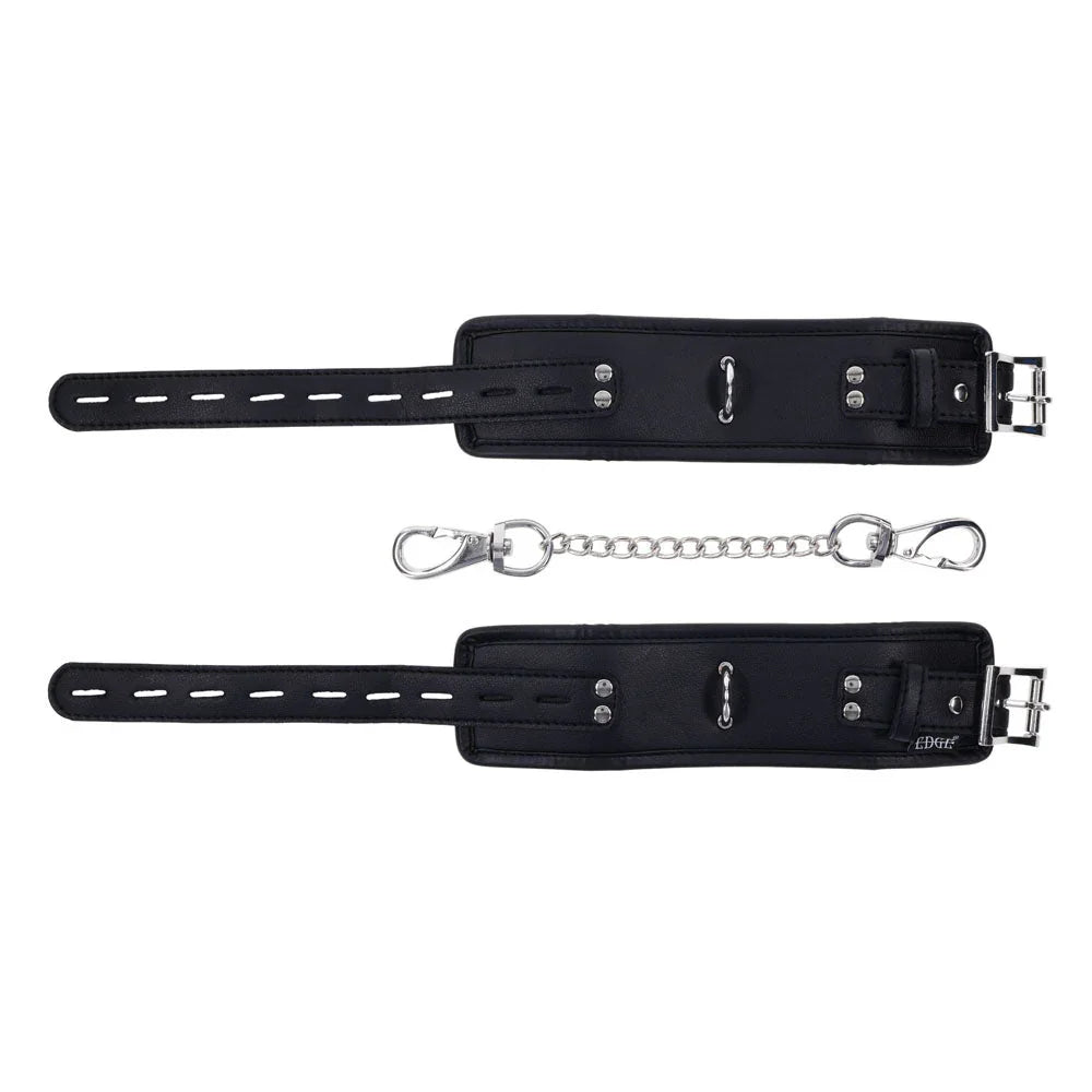 EDGE handcuffs laid flat showing the strap holes and buckles, chain between them