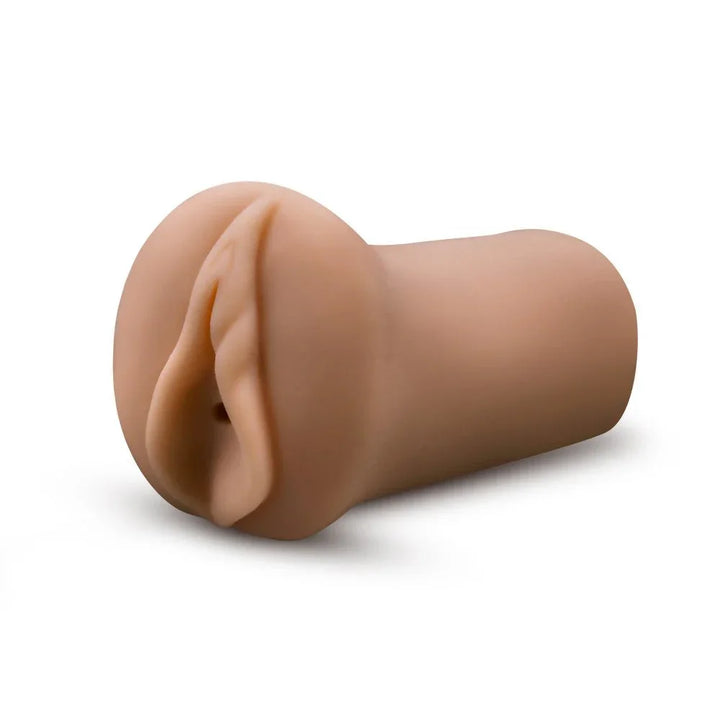 EnLust Molly stroker alone in tan, angled to show the moulded vulva opening