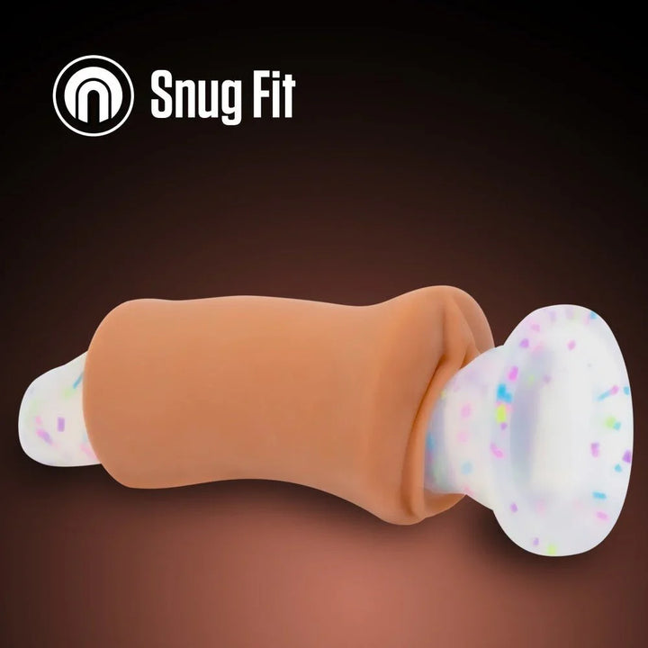 Molly stroker in tan with the confetti suction cap fitted, snug fit feature panel