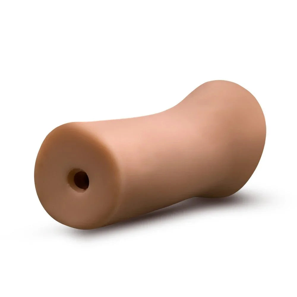 EnLust Molly stroker in tan from the open end, showing the exit hole