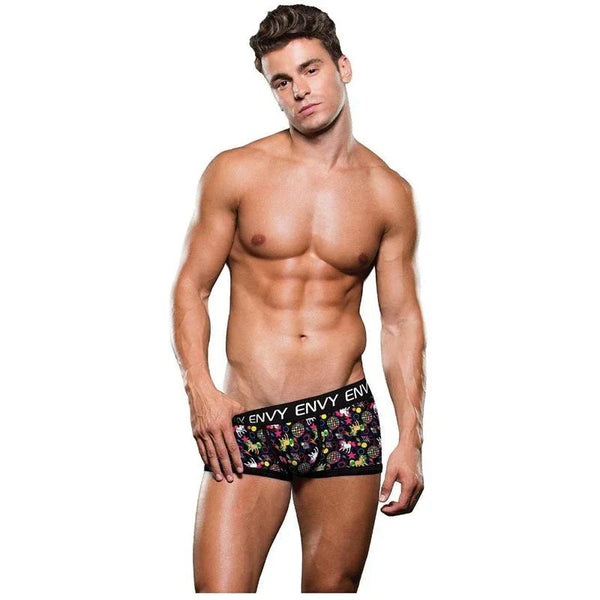 Male model wearing the Envy Disco Unicorn trunks, black with a multi-colour print