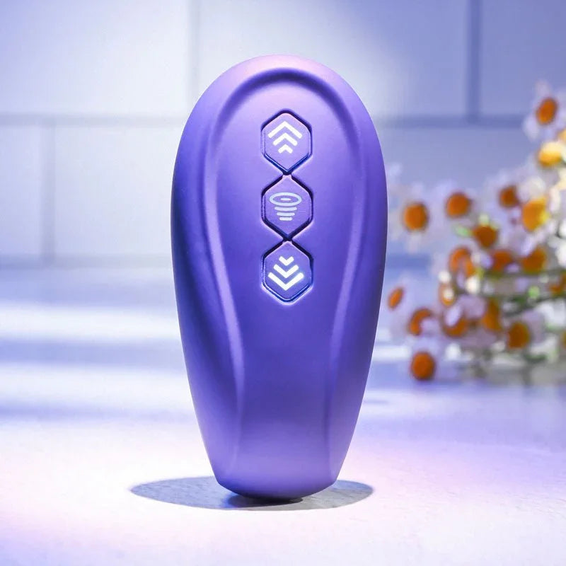 Close-up of the Purple remote for the Evolved 2 Become 1, showing its three function buttons