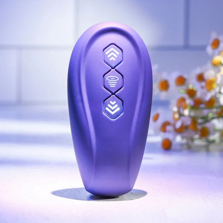 Close-up of the Purple remote for the Evolved 2 Become 1, showing its three function buttons