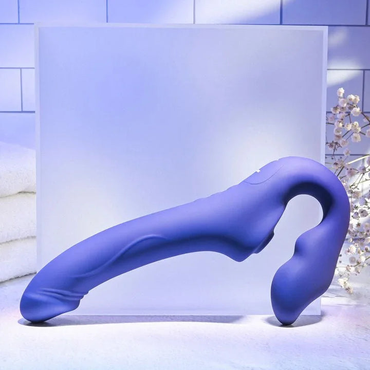Evolved 2 Become 1 in Purple lying on its side, full length profile with the bulb end to the right