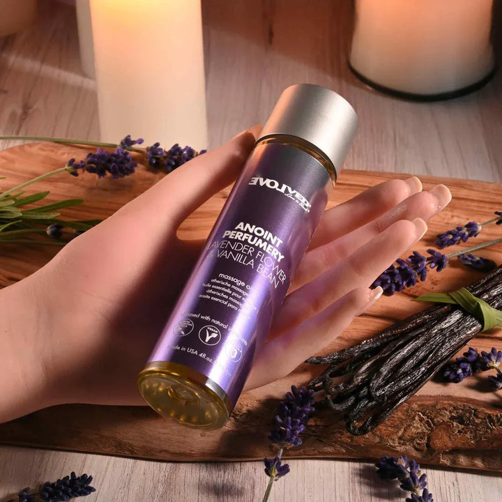 Evolved Anoint Lavender Flower & Vanilla Bean bottle held in an open hand for scale