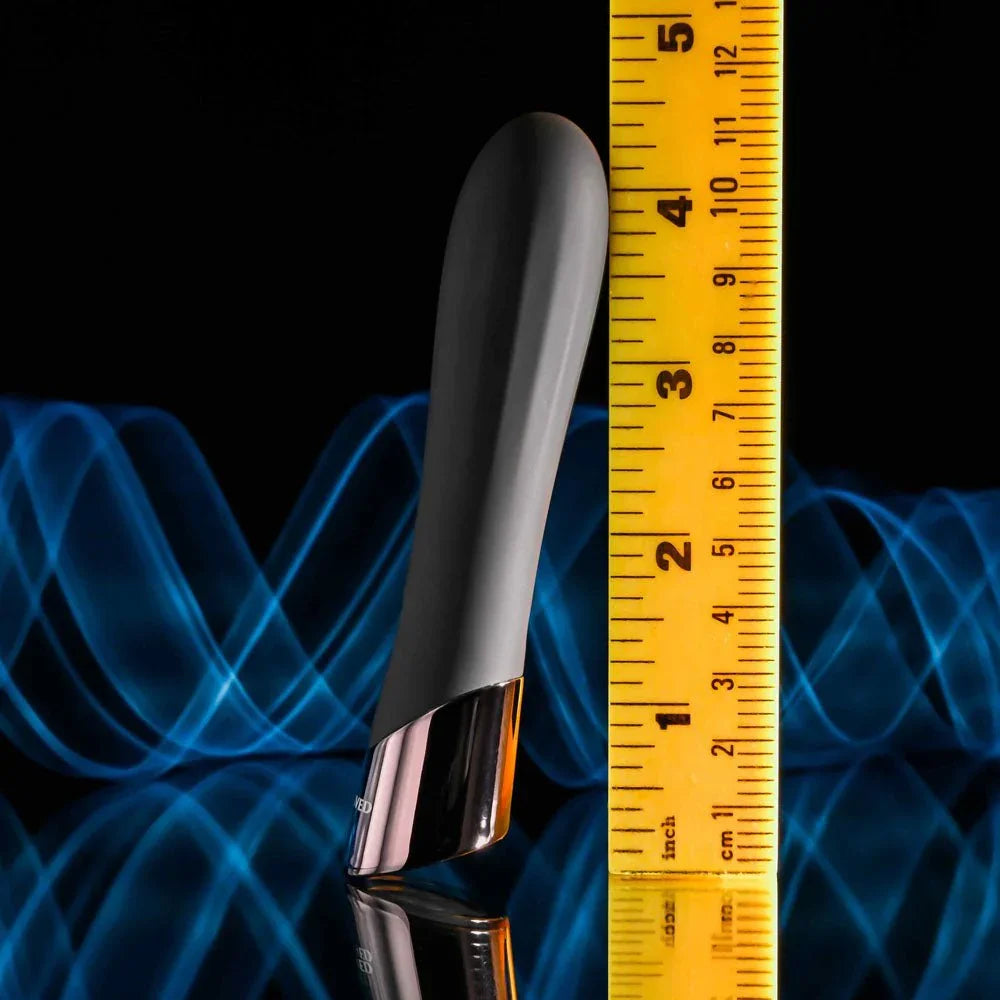 Evolved Back In Black bullet in Black stood against a tape measure, reading about 4.5 inches