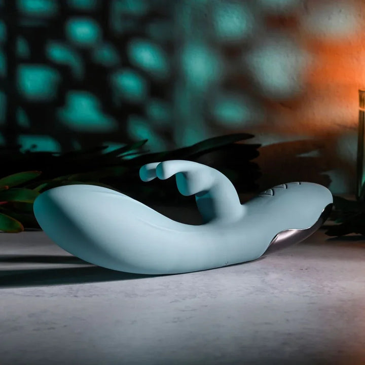 Evolved Boss Bunny in Baby Blue lying flat from the opposite side, tip towards the left